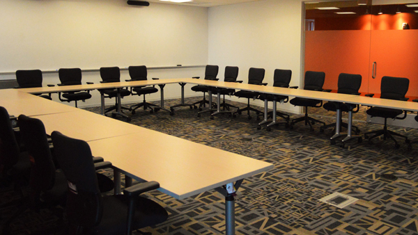 Alliance room set up with tables in a U-shape.