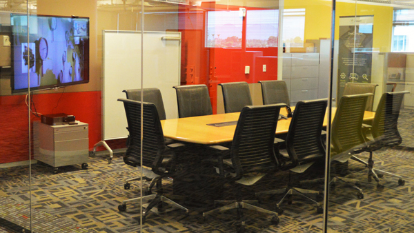 Endeavor boardroom view from hallway through glass doors