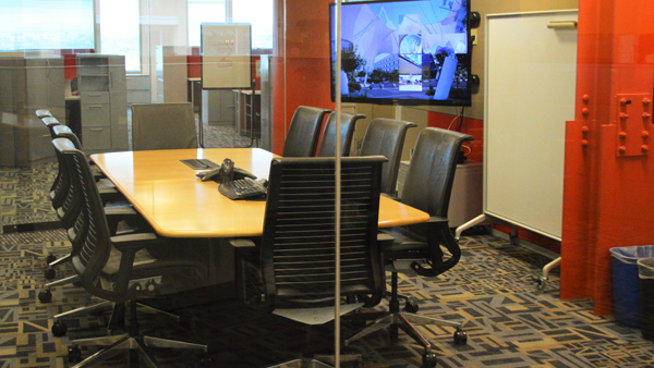 Endeavor boardroom view from hallway through glass doors
